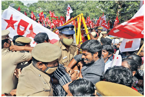 Left party workers clash with police in Chennai on Tuesday while protesting in support of farmers