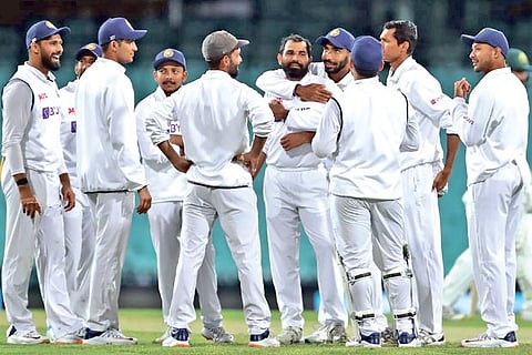 India celebrates the wicket of an Australia A batsman in the tour game
