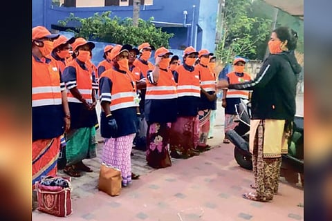 The all-women team receiving instructions from their supervisor.