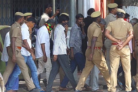 The accused being brought to the court complex located in the Madras High Court premises amid tight security