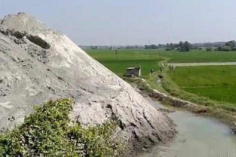 The sand dumped by the stone quarries near farmlands at Magaral near Walajabad