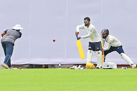Tamil Nadu wicketkeepers Dinesh Karthik and N Jagadeesan go through the drills