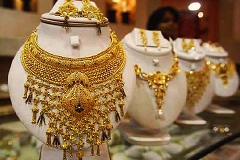 Gold prices drop Rs 396, silver falls Rs 179