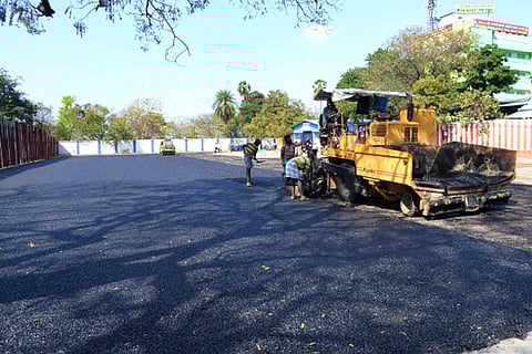 A section of the ground at the Vellore new bus stand undergoes paving to accommodate long-distance buses