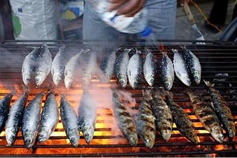 sardines being cooked (courtesy: Reuters)