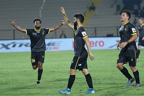 Nestor Gordillo (centre) celebrates his goal with Hyderabad teammates