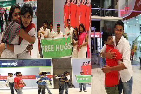 From the free hugs campaign organised in Coimbatore; A volunteer shares a hug