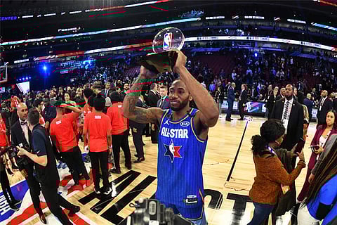 Kawhi Leonard with the Kobe Bryant All-Star Game MVP award