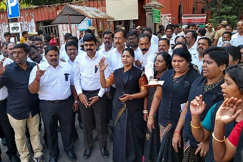 Advocates protest outside Madras HC wearing black flag on Wednesday