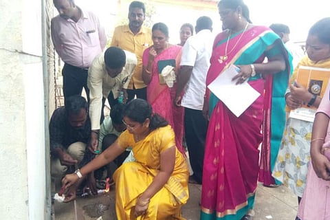 Revenue division officer Divyashree seals the water unit in Sriperumbudur, on Saturday
