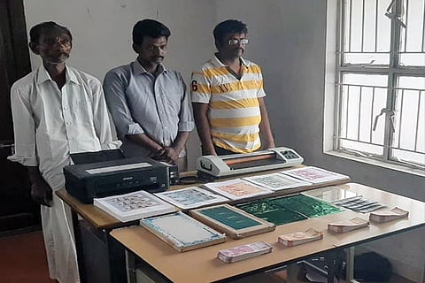 The trio with the xerox machine and the fake currency notes
