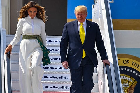 White jumpsuit and green sash, Melania pays tribute to Indian textiles