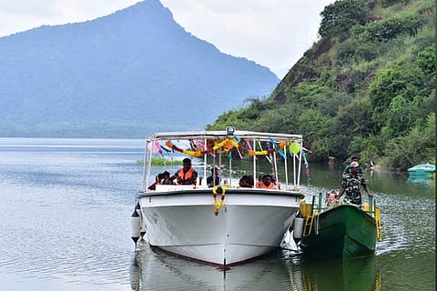 Tourists enjoying a ride on a solar-powered boat in Manimuthar dam in Tirunelveli district on Wednesday