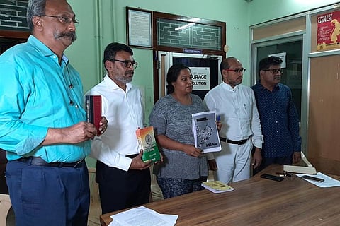 Gayatri Khandhadai with a report of her works at a press conference in Madurai on Thursday