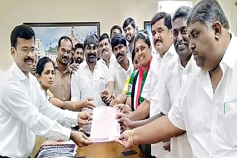 U Abinaya, daughter of AIADMK MLA VC Arukutty, receiving the election certificate for the post of district