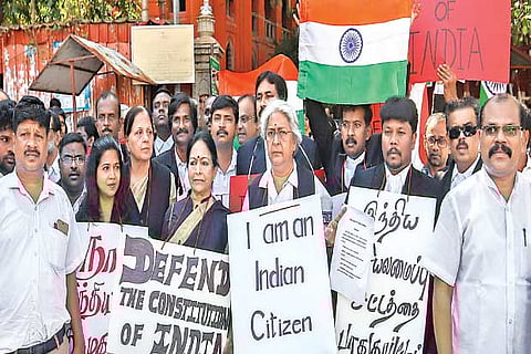 A group of Madras High Court lawyers stages a demonstration in Chennai on Friday