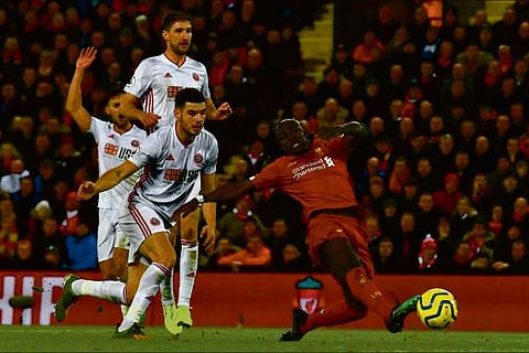 Forward Sadio Mane (right) netted a lucky second goal for Liverpool