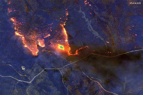 Australian bushfires ease on cooler weather, death toll rises