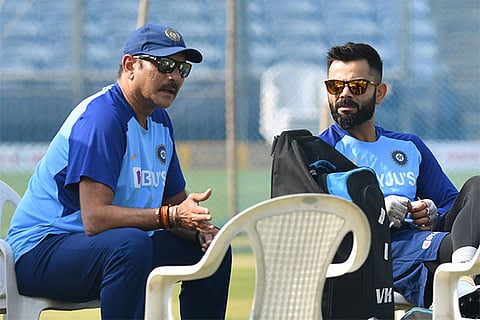 Head coach Ravi Shastri (left) and captain Virat Kohli discuss a point ahead of the third ODI on Thursday