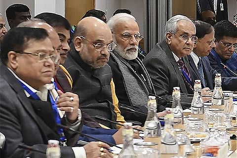 Prime Minister Narendra Modi with economists and experts at a meeting, in New Delhi