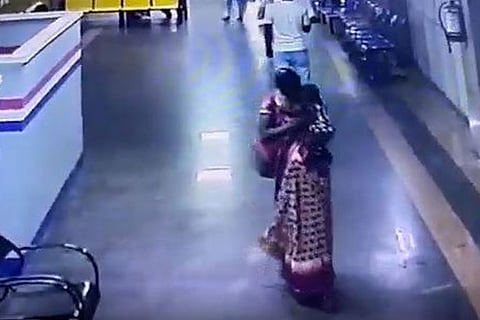 CCTV footage of woman walking away with 8-month-old baby