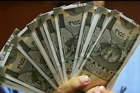 Rupee opens lower, touches 71 per US dollar in early trade