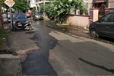 Clog in the line results in leakage of sewage on to the road