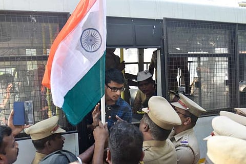 A youngster being detained by the police for demonstrating against CAA-NRC-NPR at Valluvar Kottam