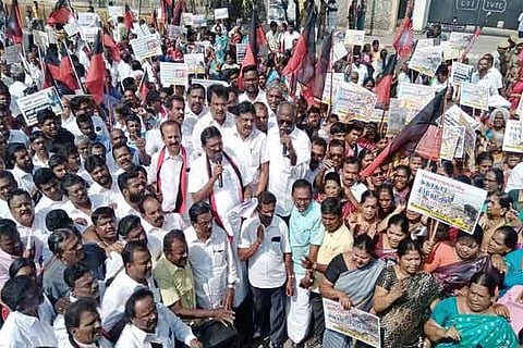 DMK workers staging the protest in Coimbatore, on Wednesday