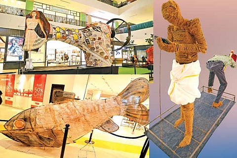 Giant sewing machine; fish made of discarded plastics; farmer stares at mobile phone