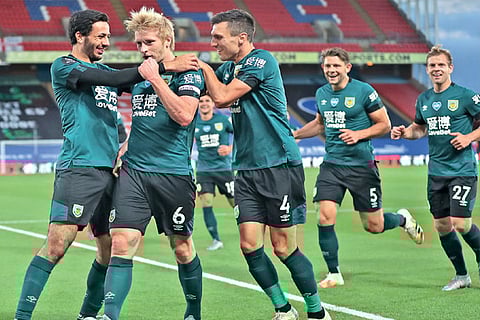 Burnley players celebrate Ben Mee?s winner against Crystal Palace