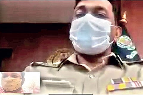 Commissioner of Police Mahesh Kumar Aggarwal hearing out a petitioner on a WhatsApp video call