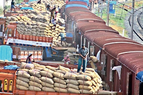 Railway staff loading goods on to a wagon in Salem