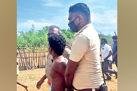 One of the suspects being taken away by Sathankulam police