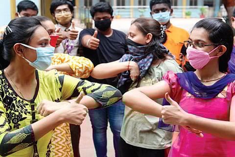 Students of Everwin School celebrate after the results were announced