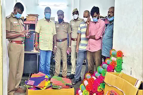 Policemen raid a shop in Virugambakkam on Thursday