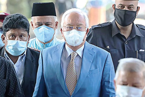 File photo of former Malaysian PM Najib Razak and supporters arriving at Kuala Lumpur High Court