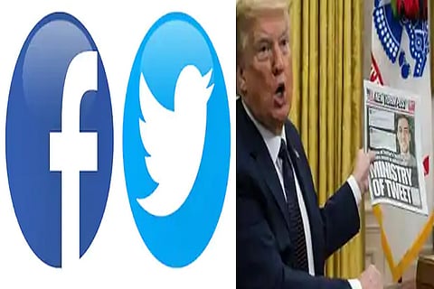 US Prez Trump holds up a newspaper front page as he discusses an executive order on social media companies