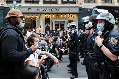 Protesters defy curfews in major US cities to march against police brutality