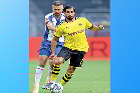 Midfielder Emre Can (right) sealed the points for Borussia Dortmund close to the hour mark
