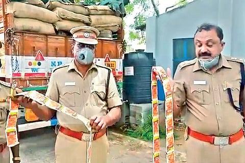 Salem police with seized tobacco products and lorry