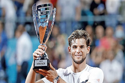 Dominic Thiem poses with the trophy