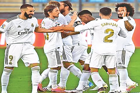 Real Madrid players are jubilant after the win