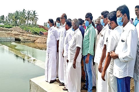 Minister KA Sengottaiyan inspecting a newly constructed check dam in Erode on Friday