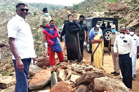 Ministers accompanied by officials, inspect the mud road connecting Nekkinamalai and Ambur