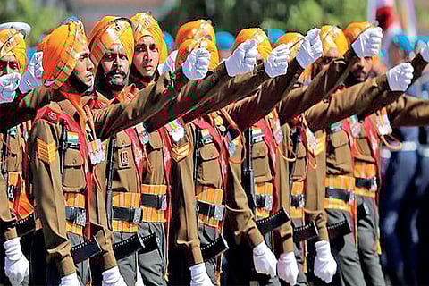 Indian servicemen from the 75-member Tri-service contingent march during the Victory Day Parade