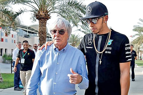 Bernie Ecclestone (left) and Lewis Hamilton