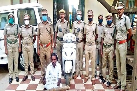 The forest team with one of the accused Thiyagu in Tiruchy on Saturday