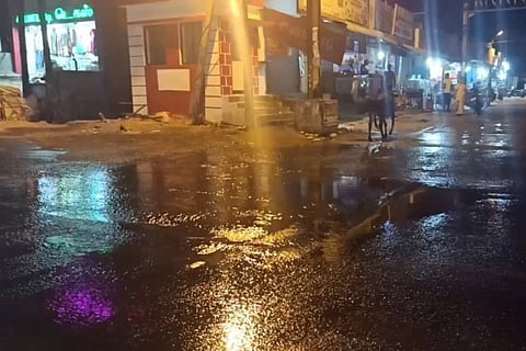 Water leaked from overhead tank through broken pipes flooding a street in Sriperumbudur