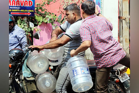 People in search of drinking water following the strike, in Coimbatore